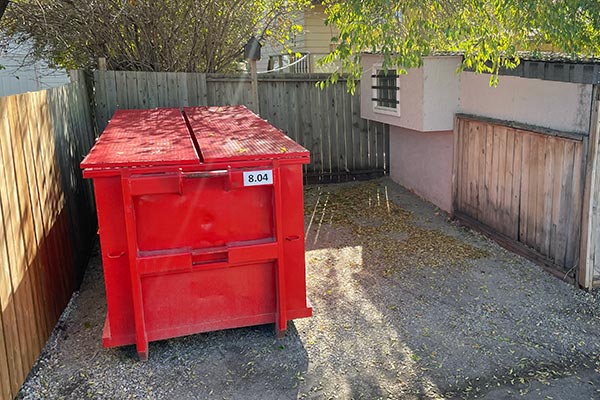 red bin on parking pad